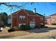Brick home with a well-maintained backyard and mature trees, providing privacy and a serene atmosphere at 6026 Southland Dr, Stone Mountain, GA 30087