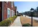 A brick house with manicured landscaping and a sidewalk at 6026 Southland Dr, Stone Mountain, GA 30087