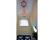 Bright foyer showcasing a large chandelier, window, and unique architectural details at 6026 Southland Dr, Stone Mountain, GA 30087