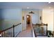 A naturally lit upstairs hallway shows detailed trim and hardwood stair rails at 6026 Southland Dr, Stone Mountain, GA 30087