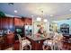 Chef's kitchen features granite counters, custom wood cabinets, an island with seating, and stainless steel appliances at 6026 Southland Dr, Stone Mountain, GA 30087