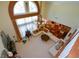 Overhead shot featuring a living area with high ceilings, a large window, and a white sectional sofa at 6026 Southland Dr, Stone Mountain, GA 30087