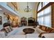 A luxurious living room with a cozy fireplace, large window, and plush seating, perfect for relaxation and entertaining at 6026 Southland Dr, Stone Mountain, GA 30087