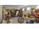 Open-concept living room with chandelier and view of dining area at 6026 Southland Dr, Stone Mountain, GA 30087