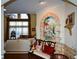 Inviting living room featuring a mural, comfortable seating, and bright natural light at 6026 Southland Dr, Stone Mountain, GA 30087