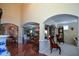 A large living room area with a dining room visible through archways at 6026 Southland Dr, Stone Mountain, GA 30087
