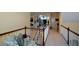 An open loft area with a white banister provides views of the lower level of the home at 6026 Southland Dr, Stone Mountain, GA 30087