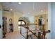 The upstairs loft area features a white banister and overlooks the lower level of the home at 6026 Southland Dr, Stone Mountain, GA 30087