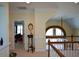 A loft area with white molding overlooks the lower level of the home, offering views of other rooms at 6026 Southland Dr, Stone Mountain, GA 30087