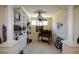 This charming office boasts custom built-ins, elegant trim, and a unique ceiling fan for added character at 6026 Southland Dr, Stone Mountain, GA 30087