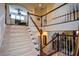 An elegant staircase featuring white and wood banisters that provides access to the upper level of the home at 6026 Southland Dr, Stone Mountain, GA 30087