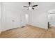 This bright bedroom features wood floors, a ceiling fan, and a large closet at 2005 Simmons Ave, Atlanta, GA 30337