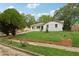 Charming single story brick home with an expansive well maintained front yard at 2005 Simmons Ave, Atlanta, GA 30337