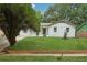 Landscaped front yard with healthy lawn complements the charming single-story home at 2005 Simmons Ave, Atlanta, GA 30337