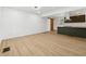 Open-concept kitchen with a sleek island and stainless steel hood at 2005 Simmons Ave, Atlanta, GA 30337
