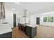 Modern kitchen boasts stainless steel appliances, new floors and sleek countertops at 2005 Simmons Ave, Atlanta, GA 30337