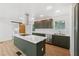 Bright kitchen boasts stainless appliances, gray-green cabinetry, and a white subway tile back-splash at 2005 Simmons Ave, Atlanta, GA 30337