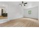 Living room features exposed brick wall, neutral color palette, and wood-look flooring at 2005 Simmons Ave, Atlanta, GA 30337