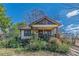 Charming bungalow featuring a cozy front porch and mature landscaping at 3630 Union Ave, Hapeville, GA 30354