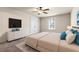 Comfortable bedroom with carpet, tv, ceiling fan and natural light at 5170 Black Bear Trl, Douglasville, GA 30135