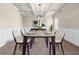 Elegant dining room with wainscoting, beamed ceiling, and stylish table setting at 5170 Black Bear Trl, Douglasville, GA 30135