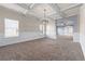 Spacious living room with wainscoting, large windows, and an open floor plan at 5170 Black Bear Trl, Douglasville, GA 30135
