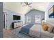 Primary bedroom with a sloped ceiling and a large bed at 5170 Black Bear Trl, Douglasville, GA 30135
