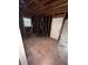 Unfinished room shows exposed framing, flooring and a window at 3518 Hamlin Cir, Atlanta, GA 30341