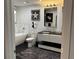 Modern bathroom with a soaking tub, a sleek vanity, and tiled floors at 361 17Th Nw St # 2423, Atlanta, GA 30363