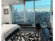 Modern bedroom showcasing floor-to-ceiling windows and city views at 361 17Th Nw St # 2423, Atlanta, GA 30363