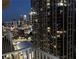 Stunning nighttime city view from the balcony, showcasing illuminated buildings and the vibrant urban landscape at 361 17Th Nw St # 2423, Atlanta, GA 30363