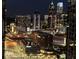 Spectacular nighttime city view showcasing illuminated skyscrapers and bustling street activity at 361 17Th Nw St # 2423, Atlanta, GA 30363