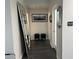 Hallway with dark wood floors and decorative mirror at 361 17Th Nw St # 2423, Atlanta, GA 30363