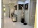 Bright hallway with white floors, stylish decor, and doorways to other rooms at 361 17Th Nw St # 2423, Atlanta, GA 30363