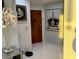 Inviting hallway with white tiled floors and decorative artwork at 361 17Th Nw St # 2423, Atlanta, GA 30363