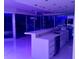 Modern kitchen with waterfall countertops, stainless steel appliances, and sliding glass doors to a private balcony at 361 17Th Nw St # 2423, Atlanta, GA 30363