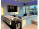 Contemporary living space with skyline views, a sleek sofa, and a black table at 361 17Th Nw St # 2423, Atlanta, GA 30363