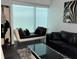Modern living room with luxury seating, stylish decor, and large windows at 361 17Th Nw St # 2423, Atlanta, GA 30363