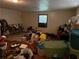 Cluttered bedroom area filled with personal belongings and dated flooring at 5581 Shadow Rock Dr, Lithonia, GA 30058