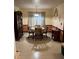 A dining room area with beige and peach walls and outdated flooring at 5581 Shadow Rock Dr, Lithonia, GA 30058