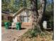 Cozy single story exterior with stone and siding, a few trees, and driveway at 5581 Shadow Rock Dr, Lithonia, GA 30058
