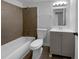 Updated bathroom features a bathtub with tiled walls, modern vanity, and a framed mirror at 5780 Par Four Ct, Lithonia, GA 30038