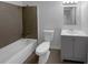 Bathroom featuring a shower-tub combo with modern fixtures and a gray vanity at 5780 Par Four Ct, Lithonia, GA 30038