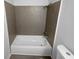 Bathroom with a white shower-tub combo with modern fixtures at 5780 Par Four Ct, Lithonia, GA 30038