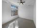 Bedroom with light walls, neutral carpet, and a large window at 5780 Par Four Ct, Lithonia, GA 30038