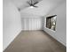Bedroom with light walls, neutral carpet, and a large closet at 5780 Par Four Ct, Lithonia, GA 30038