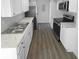 Updated kitchen with modern appliances, sleek countertops, stainless steel sink, and new flooring at 5780 Par Four Ct, Lithonia, GA 30038