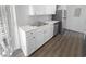 Well-lit kitchen featuring white cabinetry, stainless steel appliances, and a stainless steel sink at 5780 Par Four Ct, Lithonia, GA 30038