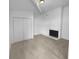 Bright living room featuring a fireplace, plush carpeting, and large closet space at 5780 Par Four Ct, Lithonia, GA 30038