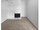 Bright living room with plush carpeting and a cozy fireplace with white trim at 5780 Par Four Ct, Lithonia, GA 30038